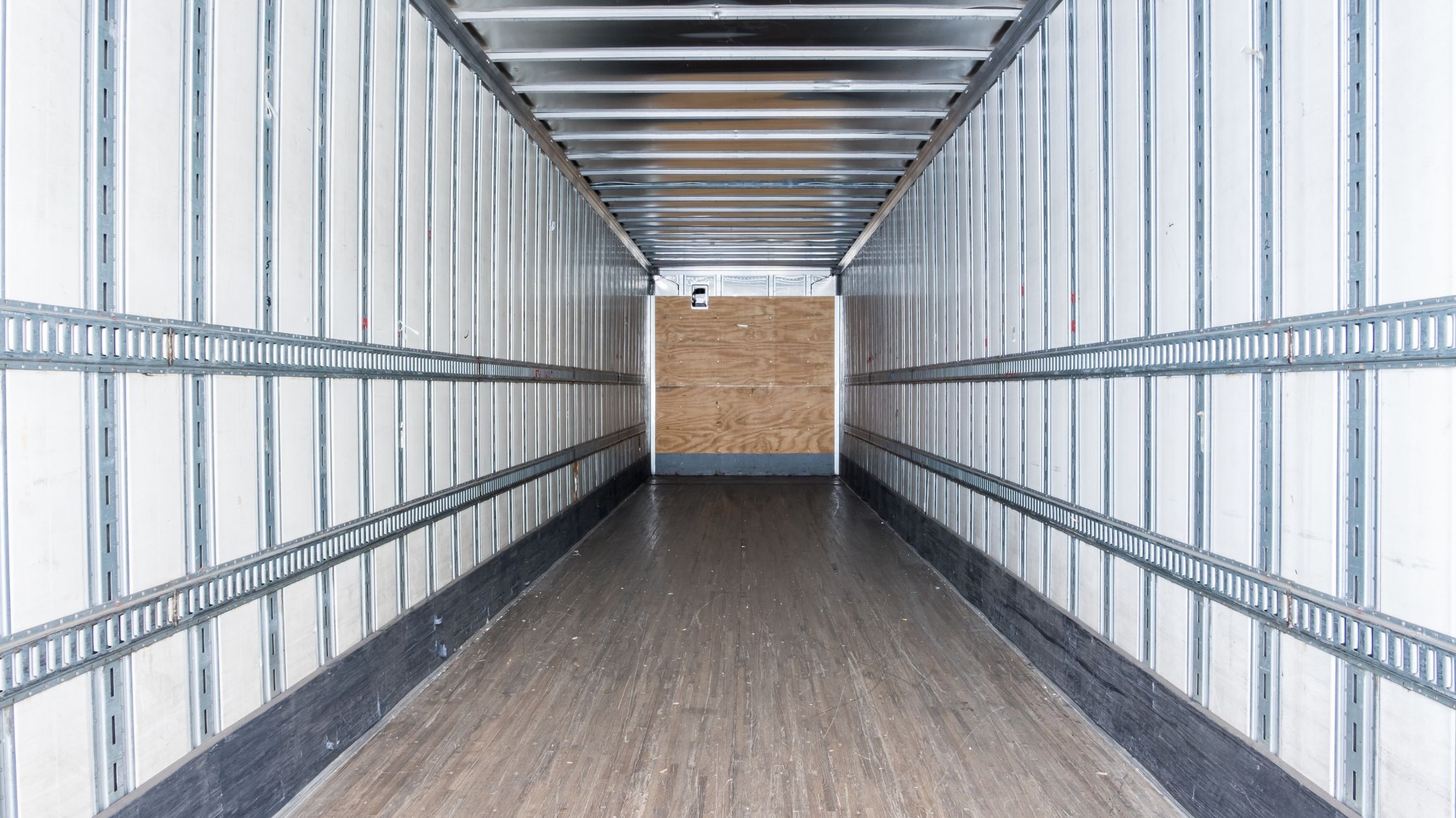 an empty dry van shipping container